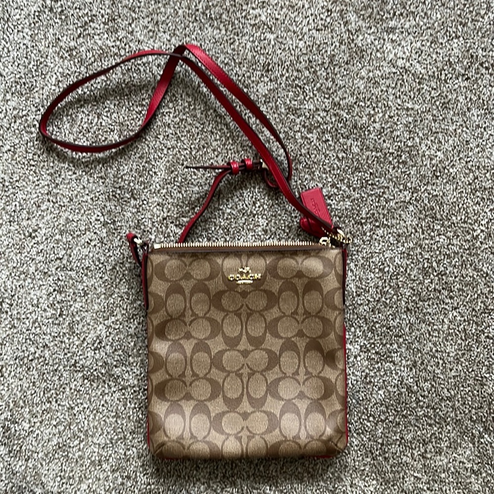 Coach crossbody purse.  Never used.  Red details.